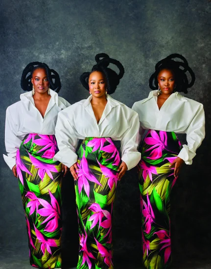 The sisters in matching tropical-print skirts