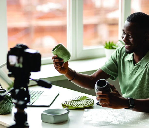 A creator filming a product video at home