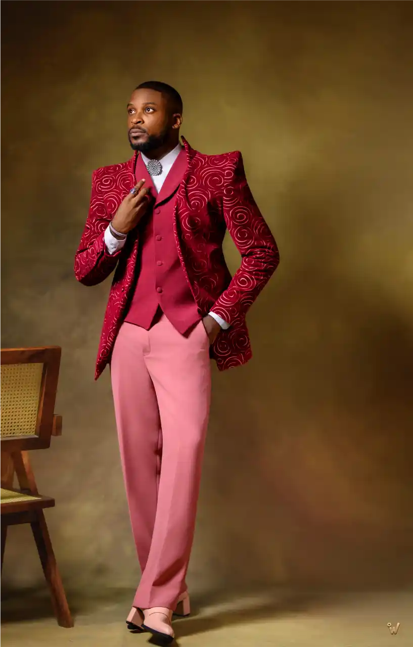 Man in embellished red and burgundy blazer suit