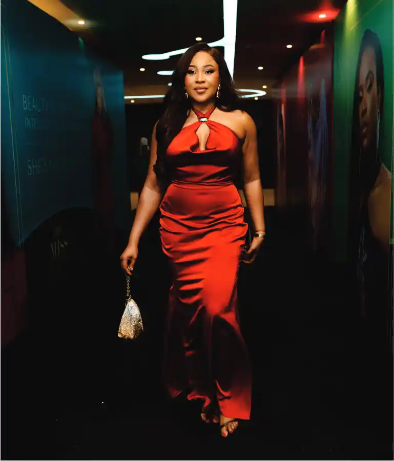 Woman in red satin halter dress