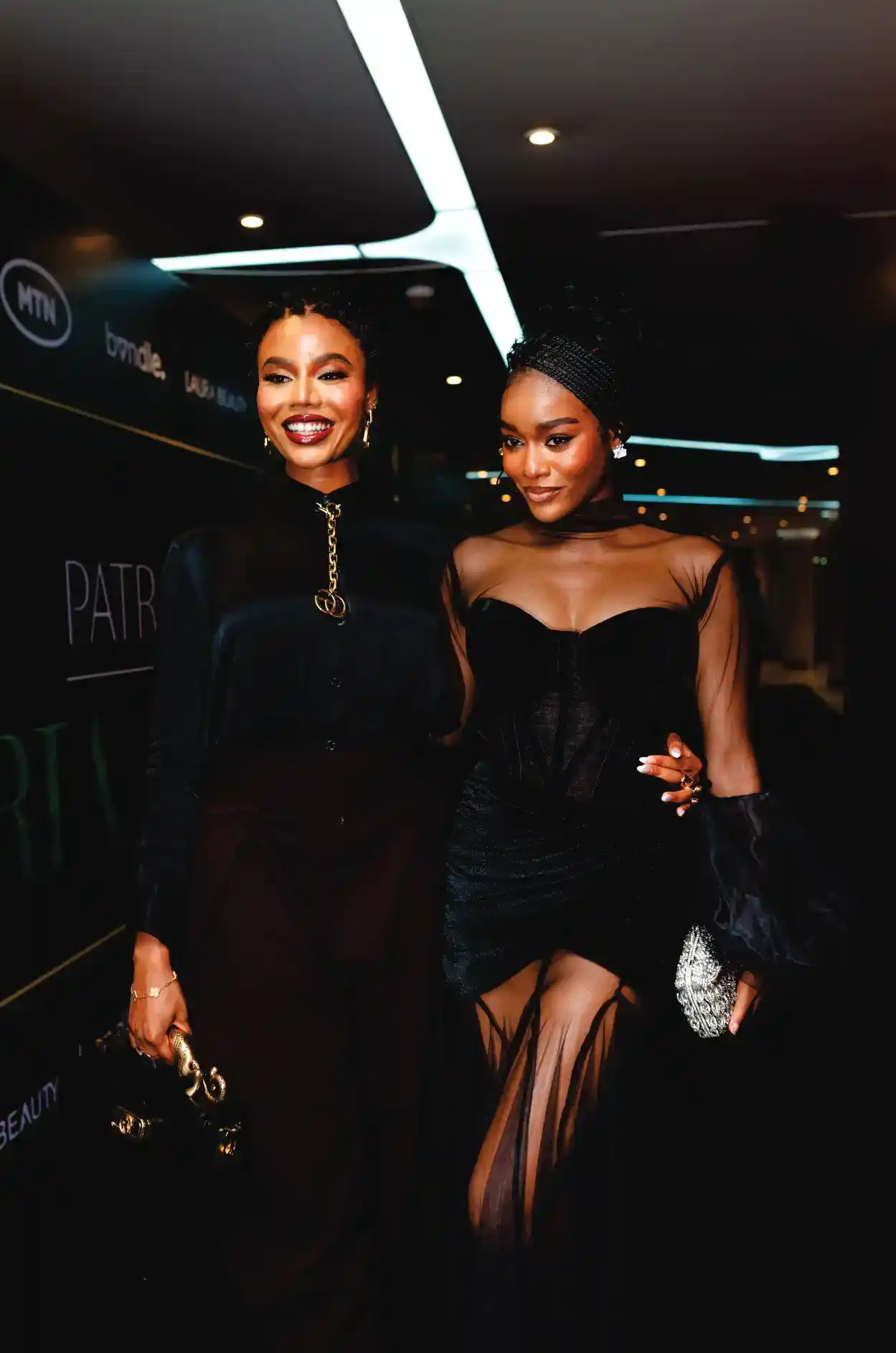 Two women in black gowns at the event