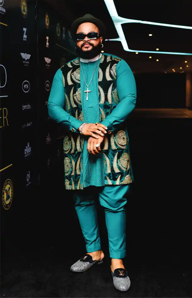 Man in teal traditional attire