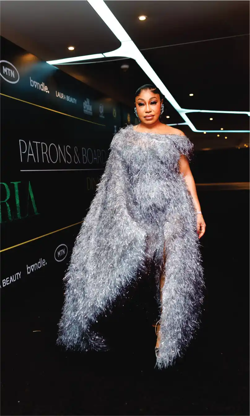 Woman in silver feathery gown on the red carpet