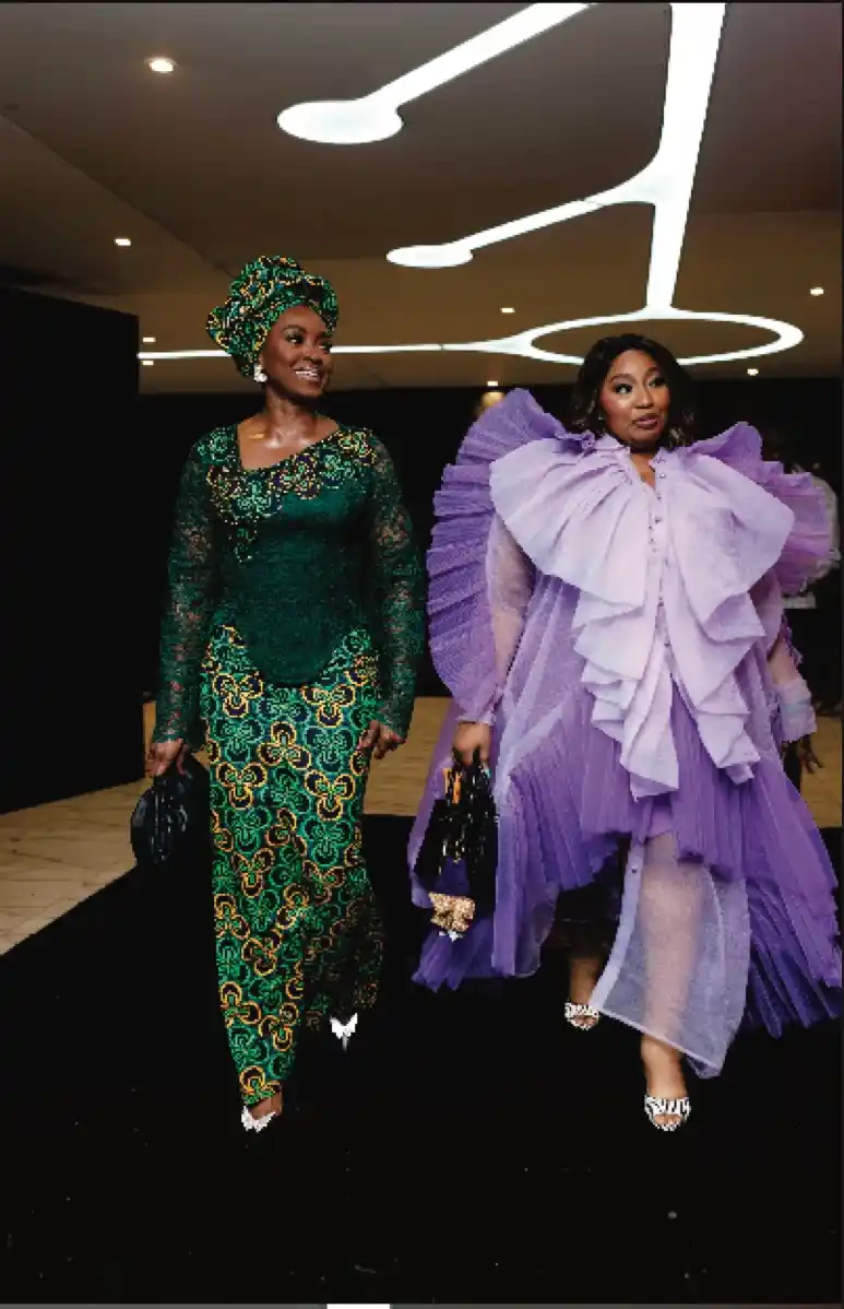 Two women in green lace and lavender ruffles