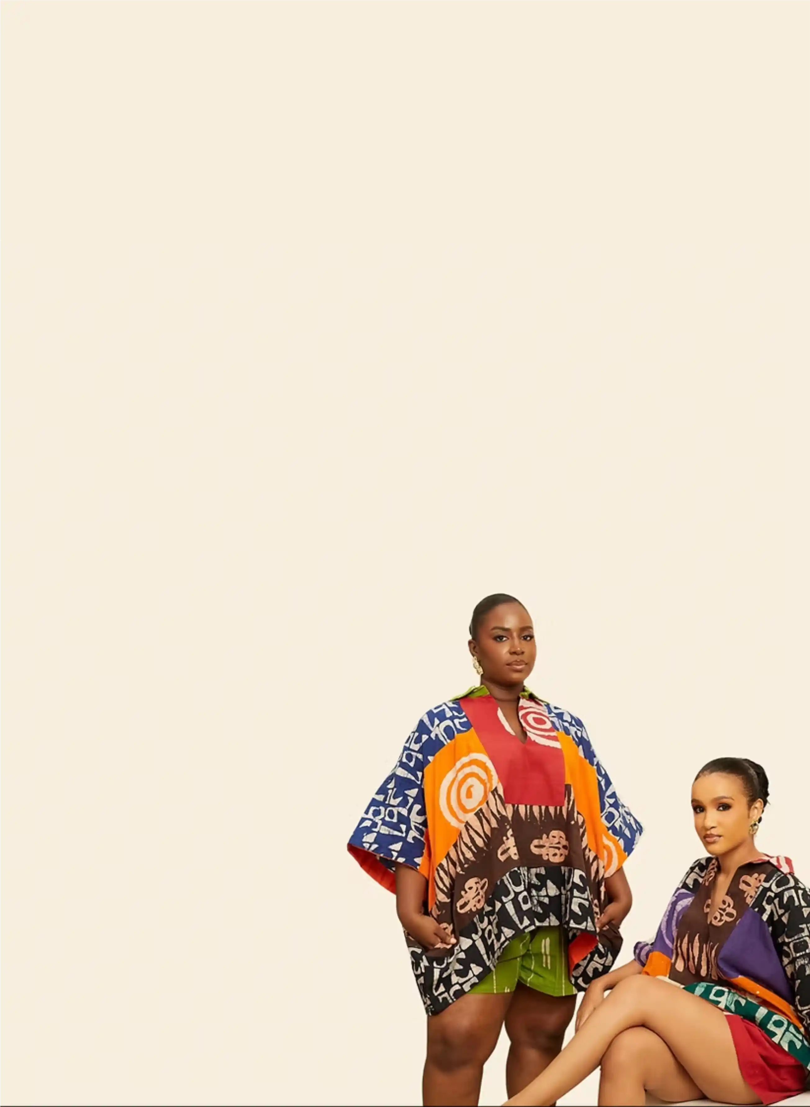 Two models wearing Sisi Jola indigenous print outfits