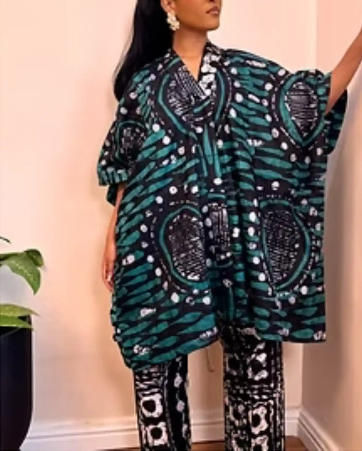 Woman in dark teal and black Ankara large kaftan