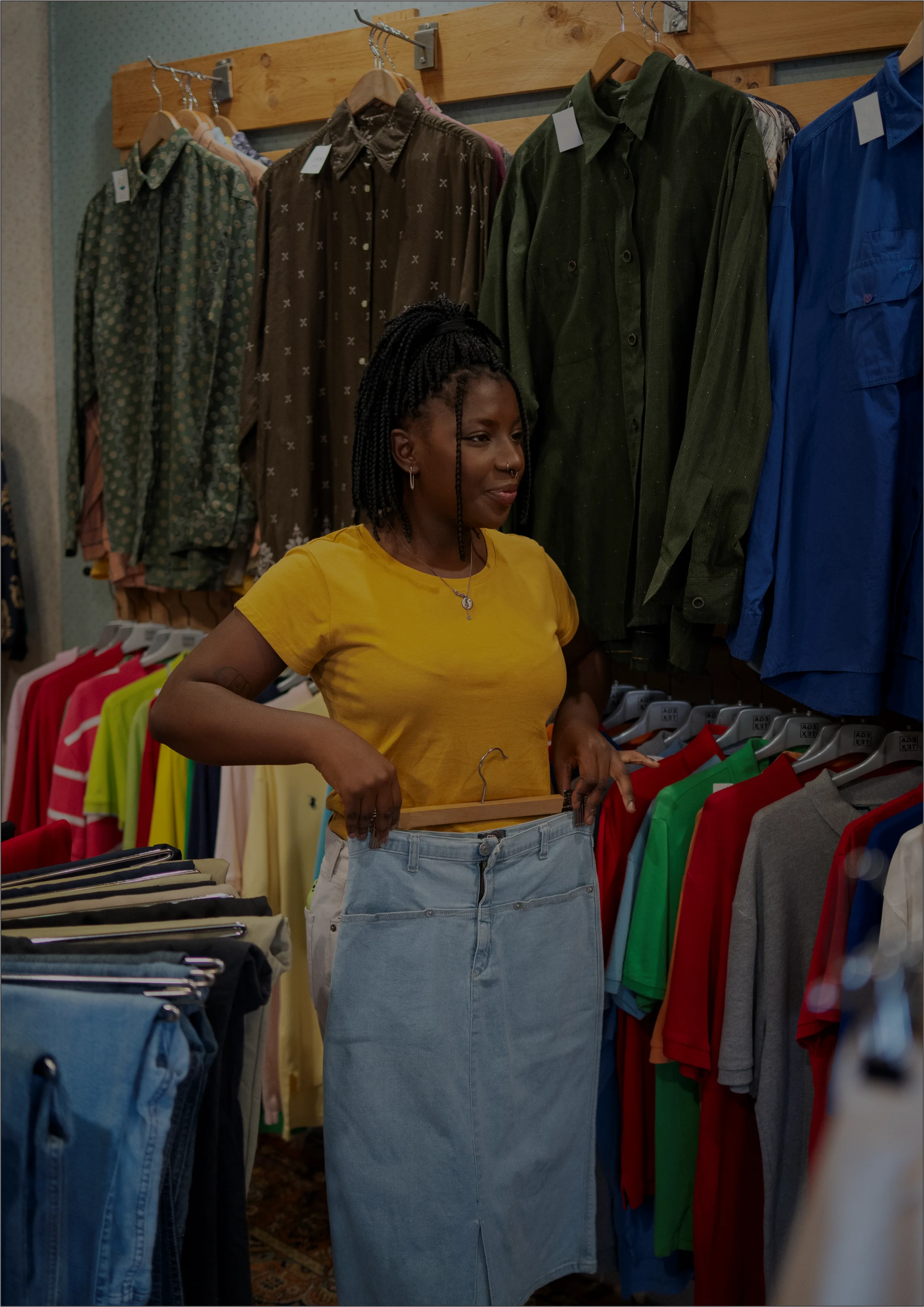 Person browsing clothes in a thrift store