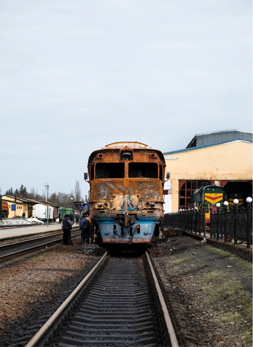 Rusty yellow train at a station