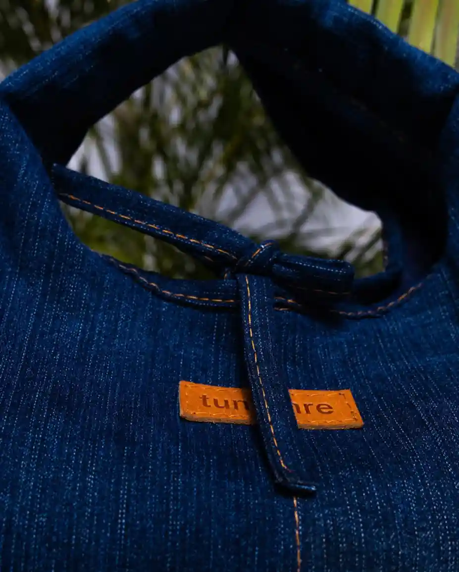 Close-up of Tuntunre denim fabric with brand label
