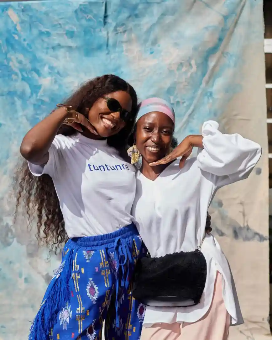 Two women wearing Tuntunre branded outfits